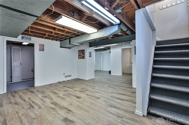 basement featuring light hardwood / wood-style flooring