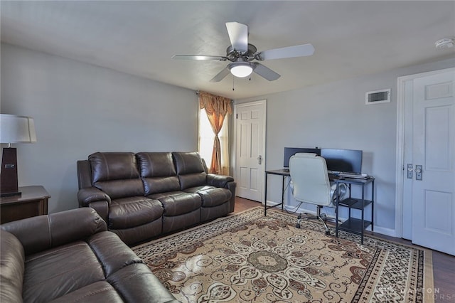 living room with hardwood / wood-style floors and ceiling fan