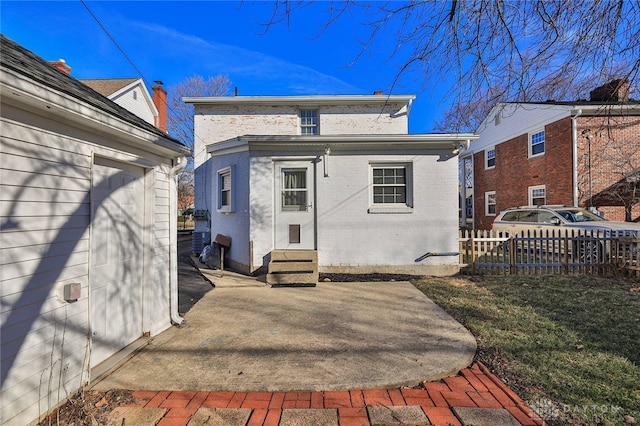 back of property with a patio area