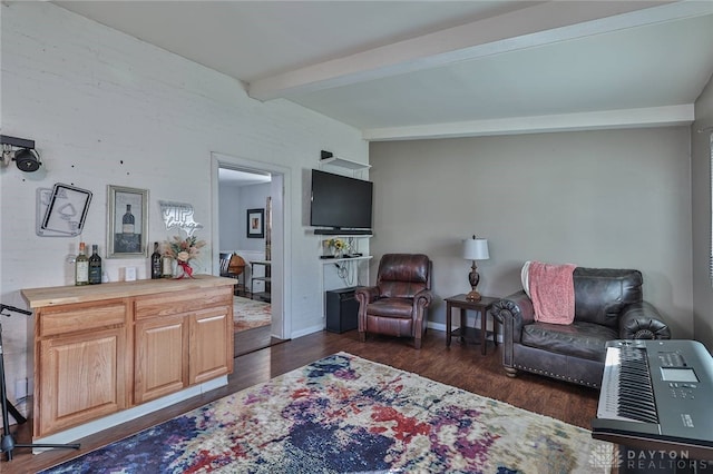 living room with beam ceiling and dark wood-type flooring