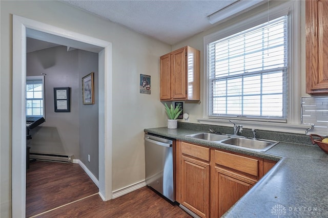 kitchen featuring sink, a textured ceiling, dark wood-type flooring, stainless steel dishwasher, and baseboard heating