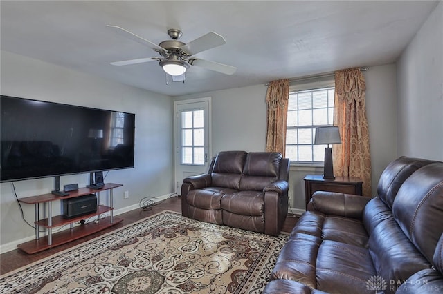 living room featuring ceiling fan and wood-type flooring