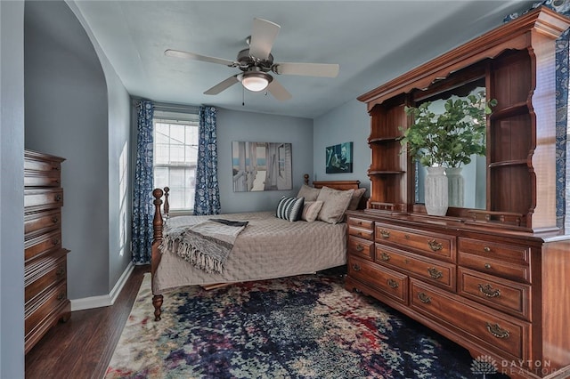 bedroom featuring ceiling fan and dark hardwood / wood-style flooring