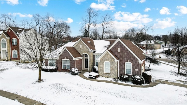 view of front of house featuring stone siding and brick siding