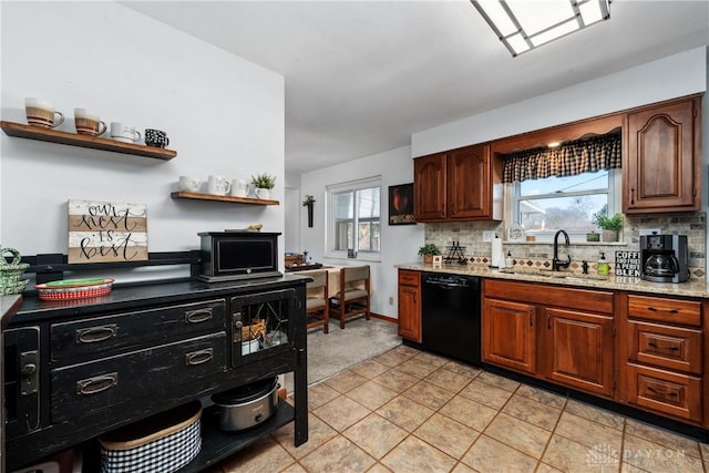 kitchen featuring a sink, black dishwasher, light stone countertops, open shelves, and tasteful backsplash