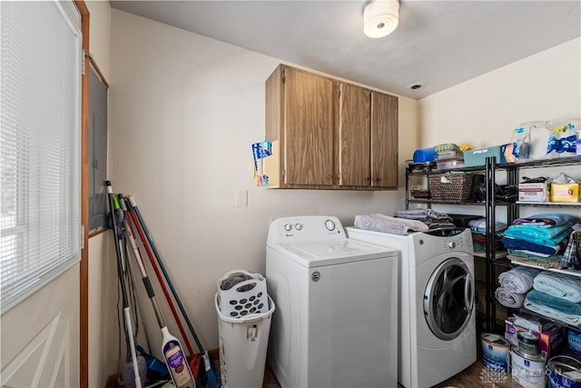 laundry area with washer and dryer and cabinet space