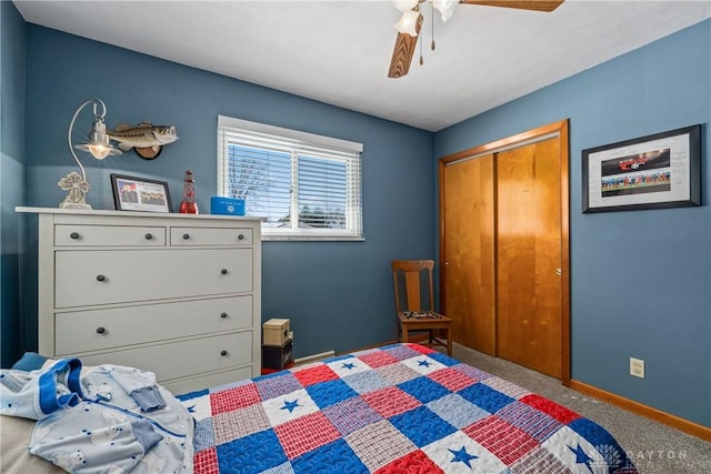 bedroom with ceiling fan, baseboards, a closet, and carpet flooring