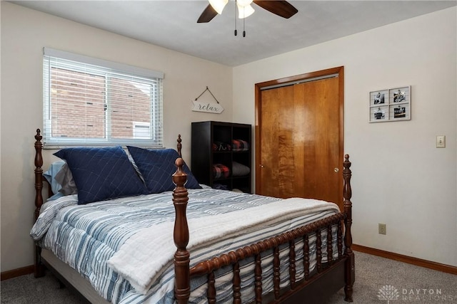 carpeted bedroom featuring a closet, ceiling fan, and baseboards