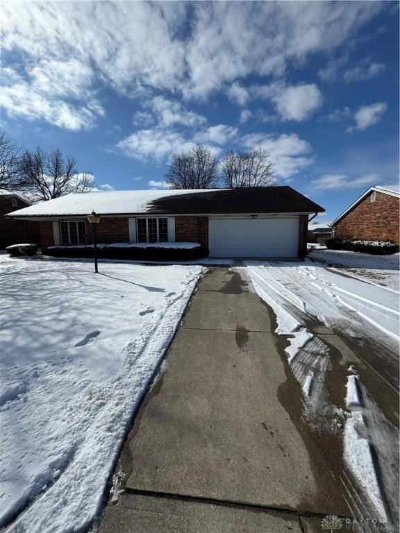 view of front of home with a garage and driveway