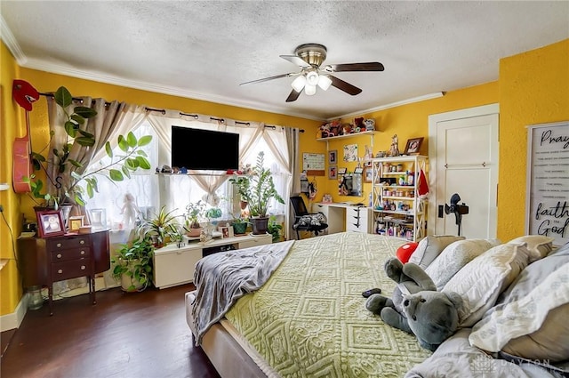 bedroom featuring crown molding, dark wood finished floors, a textured ceiling, and a ceiling fan