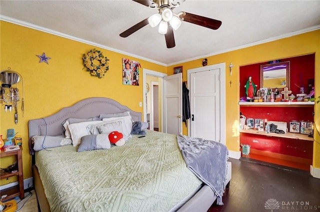 bedroom with ornamental molding, dark wood-style flooring, baseboards, and a ceiling fan