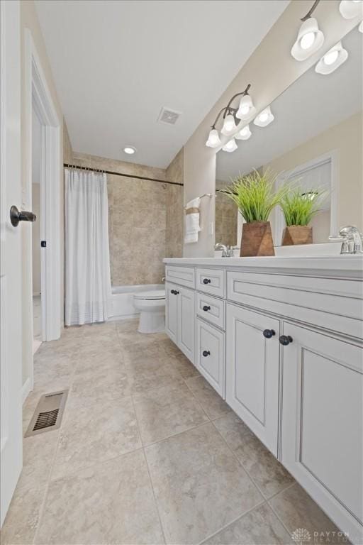 bathroom with toilet, double vanity, shower / bath combo, and visible vents