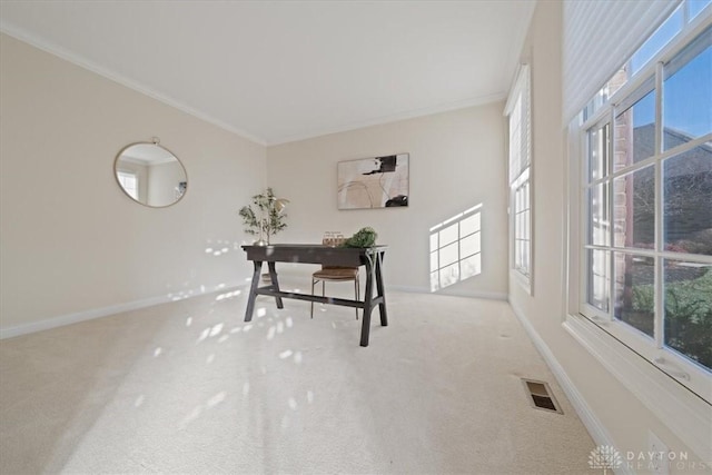 carpeted office featuring ornamental molding, visible vents, and baseboards