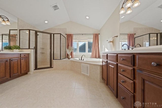 full bath with vaulted ceiling, visible vents, a bath, and tile patterned floors