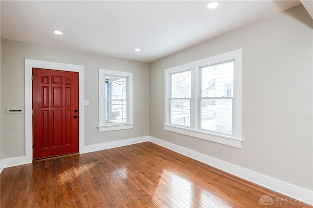 entrance foyer featuring dark wood-style floors, baseboards, and recessed lighting