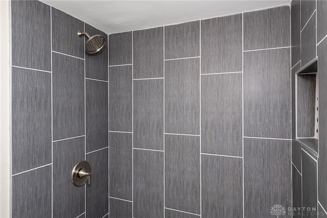 details featuring a tile shower