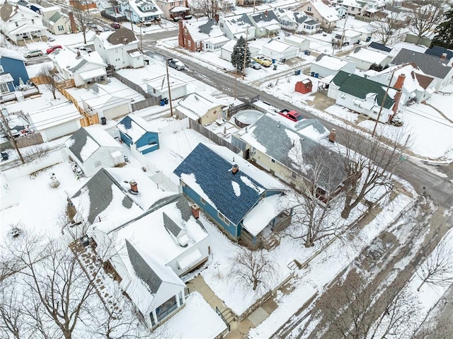 snowy aerial view with a residential view