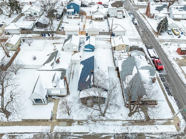 snowy aerial view with a residential view