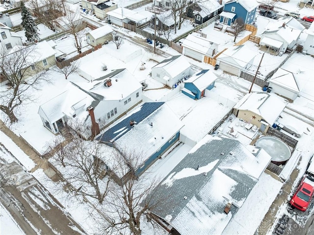 snowy aerial view featuring a residential view