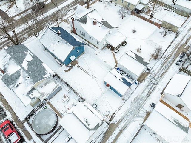 snowy aerial view featuring a residential view