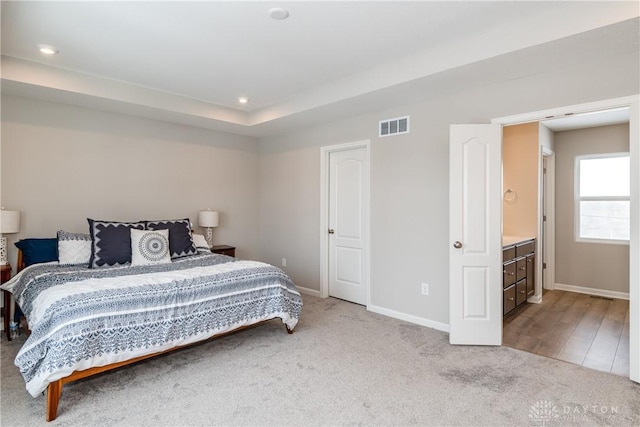 carpeted bedroom with baseboards, visible vents, and recessed lighting