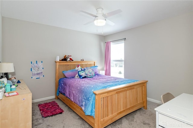 bedroom with carpet floors, baseboards, and a ceiling fan