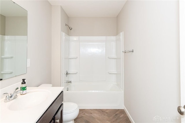 full bathroom with baseboards, shower / bathing tub combination, vanity, and toilet