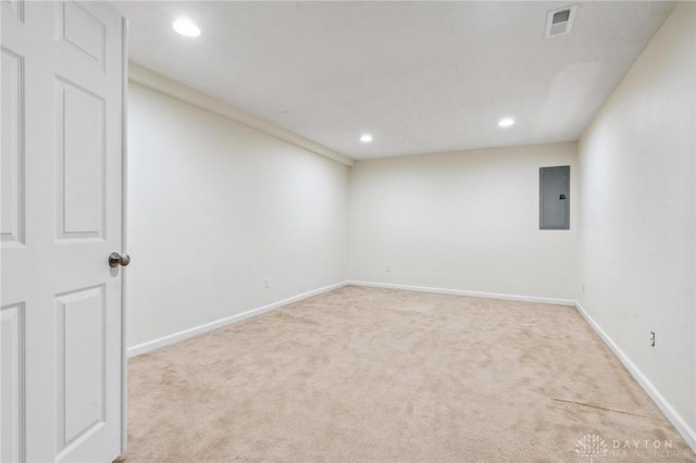 spare room featuring visible vents, baseboards, carpet floors, electric panel, and recessed lighting