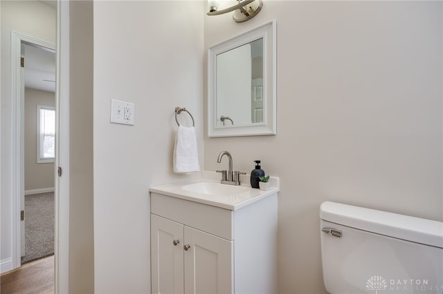 bathroom with toilet and vanity