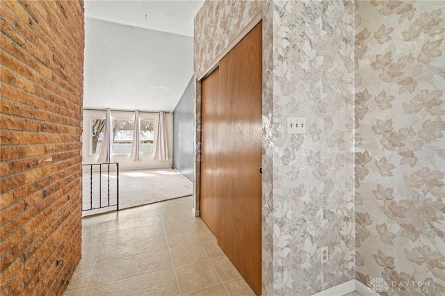 hall with light tile patterned flooring