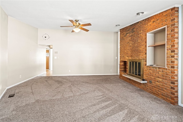 unfurnished living room with baseboards, visible vents, a ceiling fan, carpet, and a fireplace