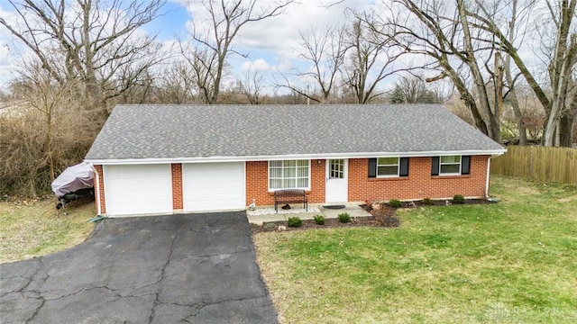 single story home featuring an attached garage, roof with shingles, aphalt driveway, and a front yard