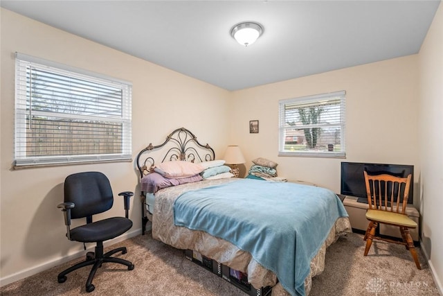 bedroom with carpet flooring and baseboards