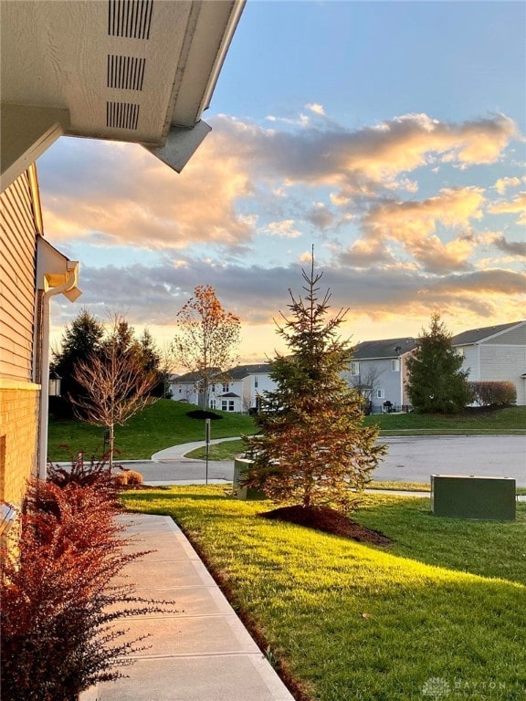 yard at dusk with a residential view