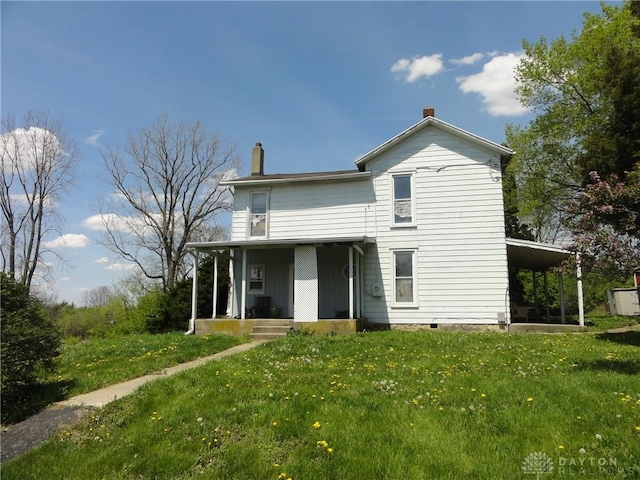 5400 S Iddings Rd, West Milton, OH 45383 - back of house featuring a chimney, covered porch, and a lawn