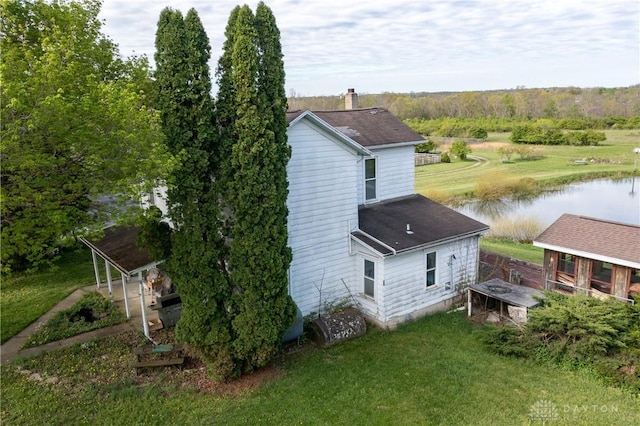 5400 S Iddings Rd, West Milton, OH 45383 - view of side of property featuring a water view, a yard, and a shingled roof