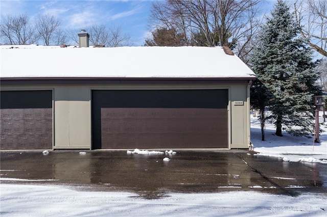 view of snow covered garage