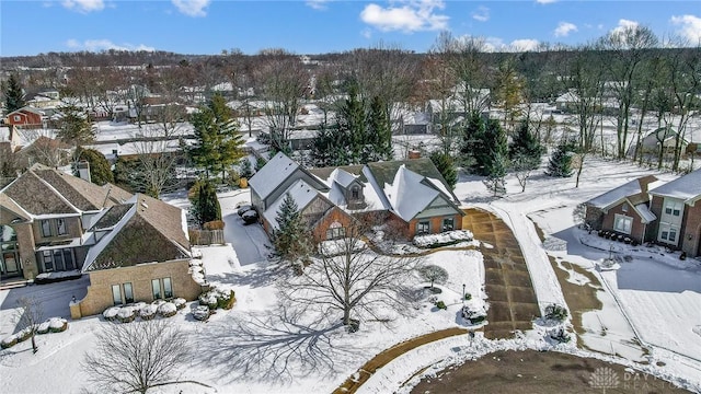 snowy aerial view featuring a residential view