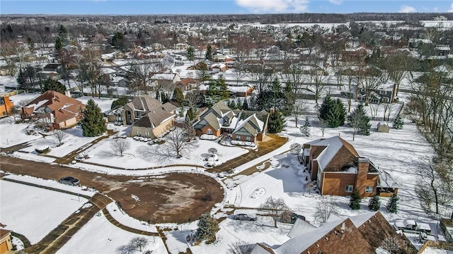 snowy aerial view featuring a residential view