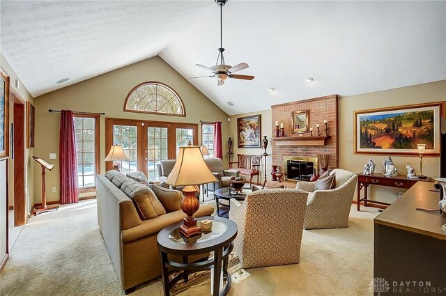 living room featuring light carpet, a healthy amount of sunlight, and french doors