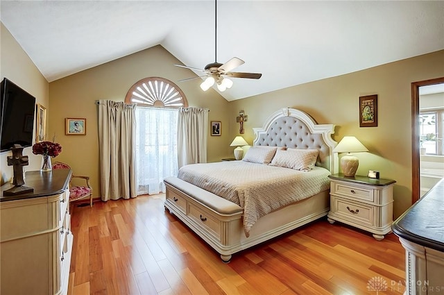 bedroom with light wood-type flooring, ceiling fan, and lofted ceiling