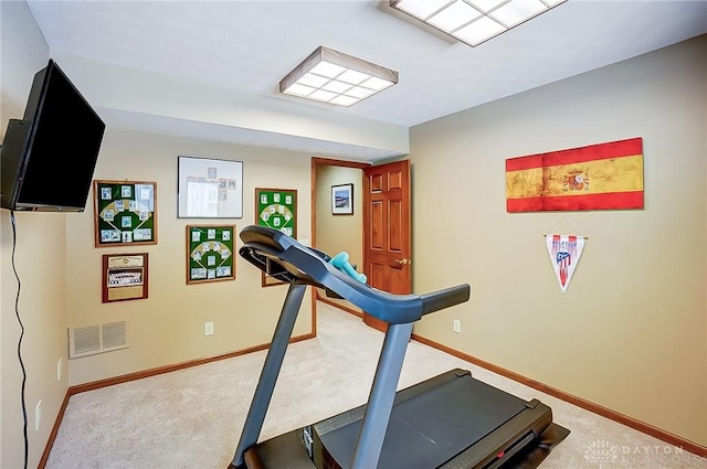 workout area featuring carpet, visible vents, and baseboards