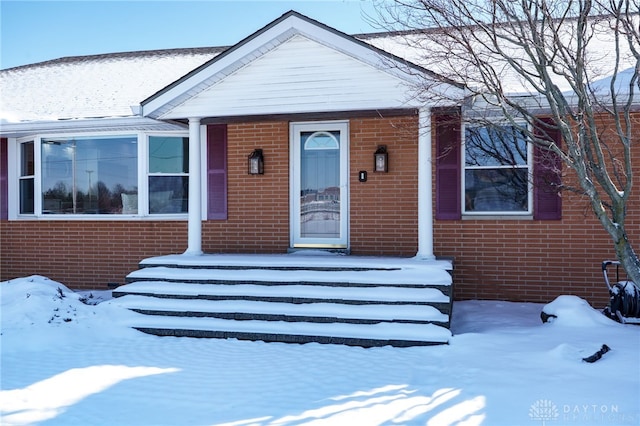 view of front of house with brick siding