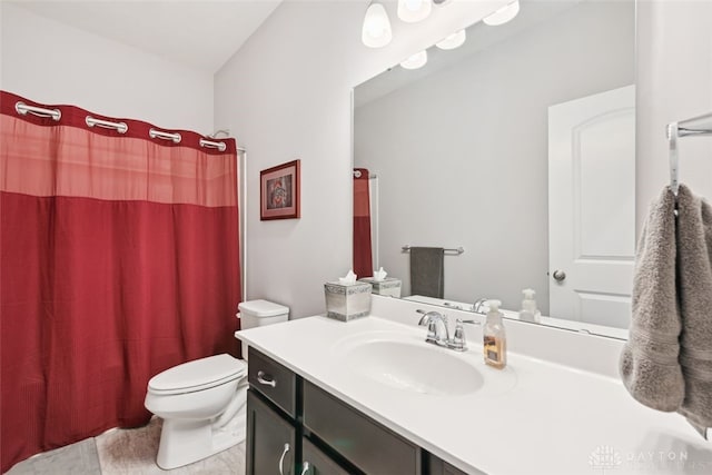 full bath with curtained shower, vanity, and toilet