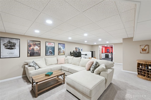 living area with recessed lighting, light colored carpet, and baseboards