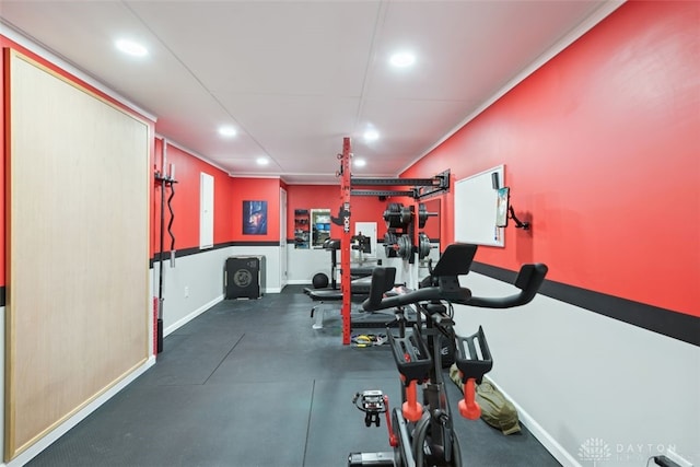 exercise room with recessed lighting and baseboards