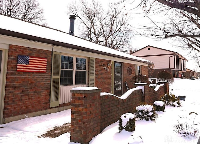 view of front of property featuring brick siding