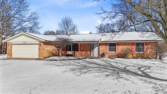 ranch-style home with brick siding and an attached garage