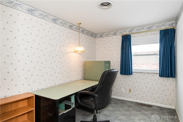 carpeted office with wallpapered walls, baseboards, and visible vents