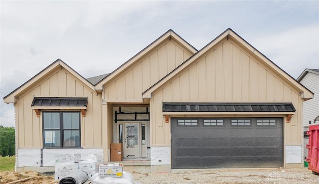 9243 Chaumont Ave, Clearcreek Twp, OH 45458 - modern farmhouse featuring board and batten siding, a standing seam roof, a garage, and metal roof